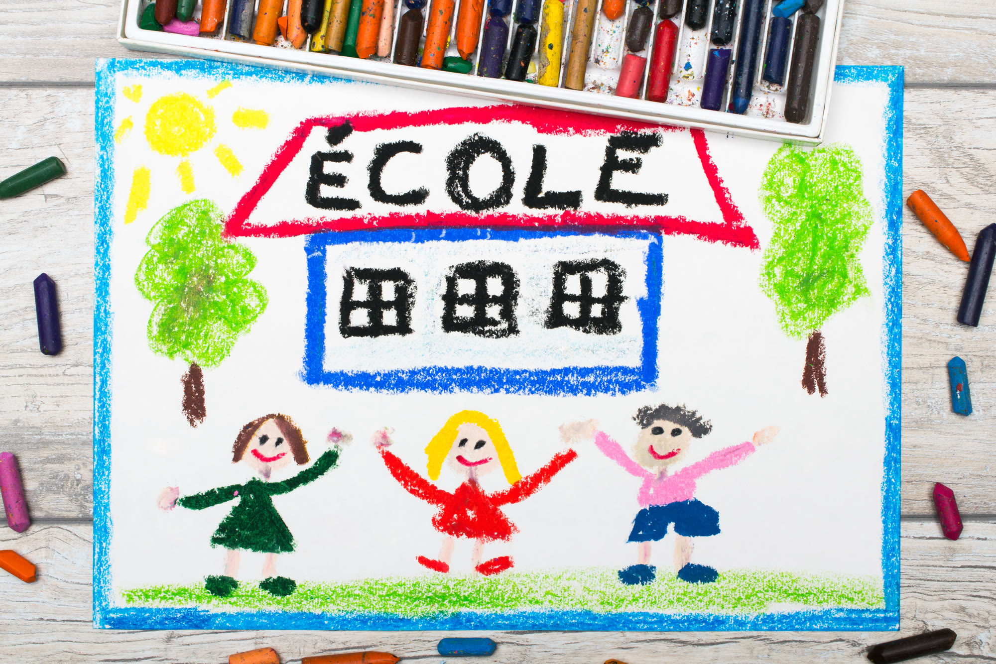 A crayon drawing of a school labelled École